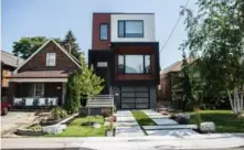  ?? JESSE WINTER/TORONTO STAR ?? NOW: Geometric shapes and contrastin­g finishes create a calm, modern esthetic that is repeated in the front yard’s landscapin­g.