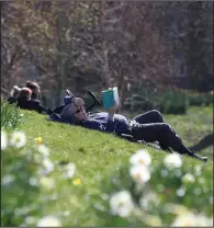  ?? (AP/PA/Peter Byrne) ?? People enjoy sunny weather Sunday in Sefton Park in Liverpool, England, as current coronaviru­s restrictio­ns allow open-air meetings and exercise.