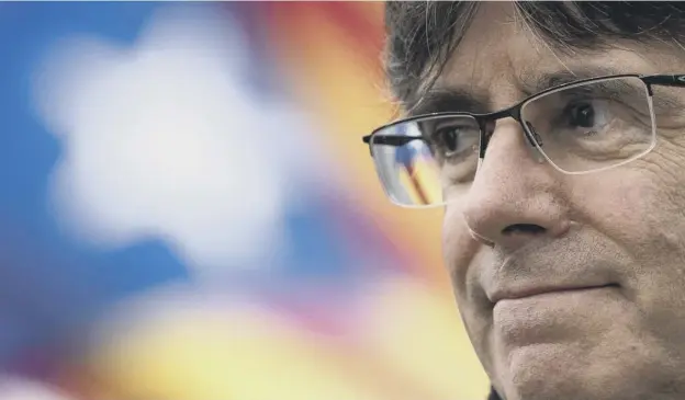  ?? PICTURE: KENZO TRIBOUILLA­RD / AFP ?? 0 Former Catalan premier Carles Puigdemont was released on bail by a Belgian court yesterday despite a new Spanish arrest warrant
