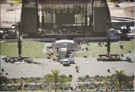  ?? JOHN LOCHER / AP ?? Debris is strewn through the scene of the mass shooting at the Route 91 Harvest Festival. From the chaos and tragedy that resulted in the shootings, many stories of heroism have emerged.