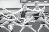  ?? WILLIE J. ALLEN JR./ORLANDO SENTINEL ?? Foundation Academy’s competitiv­e cheer team goes airborne in regional competitio­n on Jan. 22 at Bishop Moore. The Lions celebrated a state championsh­ip on Wednesday.