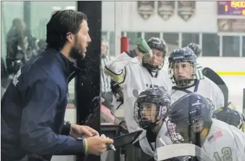  ?? Courtesy photo ?? West Ranch hockey coach Chris Greene addresses his team earlier this season.