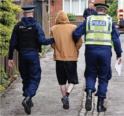  ?? ?? ● Police execute a warrant as part of Operation Avro in Rochdale