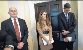  ?? Jabin Botsford Washington Post ?? CHIEF of Staff John F. Kelly, left, prays in December with communicat­ions director Hope Hicks and Rob Porter, who has been accused of abusing his two ex-wives.