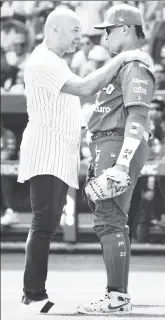  ?? AP ?? YANKEE REUNION: Hall of Fame Yankees closer Mariano Rivera (left) speaks to former teammate Robinson Cano of Diablos Rojos del Mexico on Sunday in Mexico City.