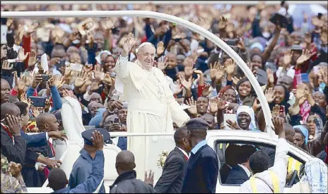 ?? REUTERS ?? Pope Francis waves to the faithful in Nairobi, Kenya yesterday.