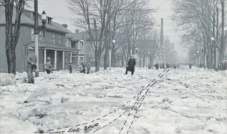  ?? COURTESY OF STEPHANIE KIRKWOOD WALKER ?? The West Side Spur connected the Lake Erie & Northern Electric Railway’s main line to several large industries on the west bank of the Grand River. Blockages such as this 1930 flood affected manufactur­ing for several days.