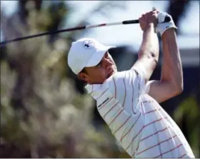  ?? MARCO GARCIA — THE ASSOCIATED PRESS ?? Jordan Spieth watches his shot from the first tee during the second round of the Sony Open golf tournament, earlier this season in Honolulu. Seven tournament­s into the year, Spieth hasn’t had many serious chances at winning so far.