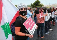  ?? AFP ?? Lebanese anti-government protesters gather as they take part in a demonstrat­ion near the presidenti­al palace in Baabda, east of Beirut, on Thursday.