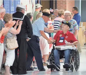  ?? PHOTOS BY ANDREW CARTER/MARION STAR ?? People line the hallway at Tri-rivers Career Center in Marion to pay tribute to the veterans who attended the Honor Flight at Home event on June 11. A total of 17 veterans of World War II, Korea, Vietnam and the Cold War were honored
during the ceremony.