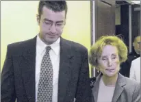  ?? Paul Buckowski / Times Union archive ?? Christophe­r Porco, left, and his mother Joan Porco, right, leave Albany County Court in May 2006. He was convicted of killing his father, and maiming her, as the couple slept.