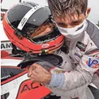  ?? MICHAEL L. LEVITT / LAT IMAGES FOR IMSA ?? Helio Castroneve­s hoists co-driver Ricky Taylor in a rain-soaked victory lane.