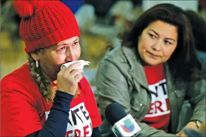  ?? AP PHOTO ?? El Salvador immigrants Diana Paredes, left, and Isabel Barrera, react at a news conference following an announceme­nt on Temporary Protected Status for nationals of El Salvador, in Los Angeles Monday.