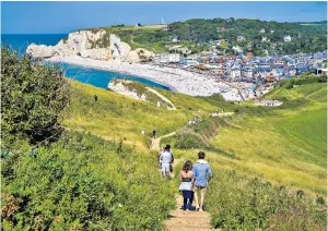  ?? ?? Étretat provides France’s answer to Dover’s stunning white cliffs