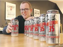  ?? JASON KRYK ?? Dean Scott, managing director for Shoutabout Creative Agency shows off the new Freedom 35 Trailer Park Boys beer, which is available at the LCBO.