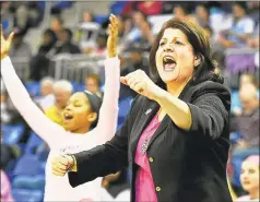  ?? Catherine Avalone / Hearst Connecticu­t Media ?? Quinnipiac head coach Tricia Fabbri celebrates on the sideline as the Bobcats defeated Iona, 5345, in 2017.