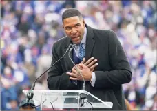  ?? Corey Sipkin / Associated Press ?? Former New York Giants player Michael Strahan speaks during a halftime ceremony on Sunday.