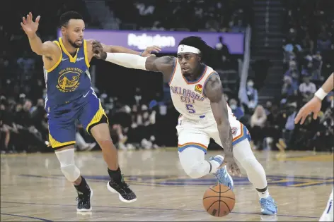  ?? JEFF CHIU/AP ?? OKLAHOMA CITY THUNDER FORWARD LUGUENTZ DORT (5) IS DEFENDED BY GOLDEN STATE WARRIORS guard Stephen Curry (30) during the first half of a game in San Francisco Saturday.