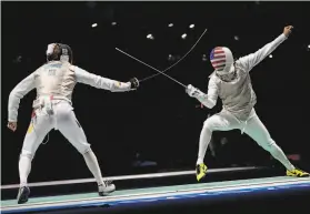  ?? Hassan Ammar / Associated Press ?? Following eight days of quarantine, former Stanford fencer Alexander Massialas lost to Germany’s Peter Joppich in their opening match.