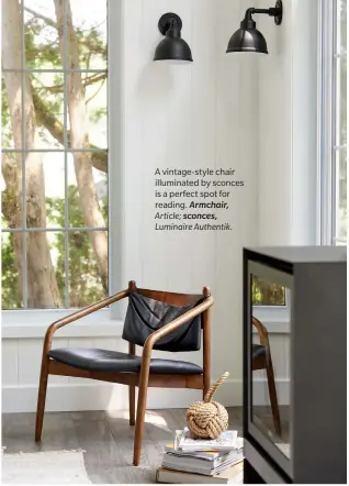  ??  ?? A vintage-style chair illuminate­d by sconces is a perfect spot for reading. Armchair, Article; sconces, Luminaire Authentik.
