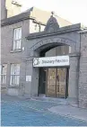  ??  ?? Top: Workers inside Discovery Flexibles’ Dundee factory. Above: The Kemback Street premises from which the company has operated since 1866 - a date visible above the entrance.