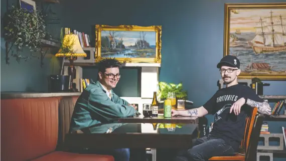  ?? PHOTOS: AZIN GHAFFARI ?? Bill Bonar, owner and operator of Rain Dog Bar, left, and head chef Chris Lorenz enjoy a non-pretentiou­s beer in the relatively new bar on Inglewood’s main drag.