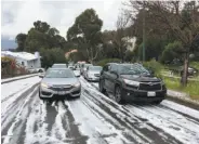  ?? Oakland Police Department ?? A hailstorm that hit several parts of the Bay Area caused slippery conditions in the Oakland hills.