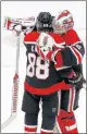  ?? STACEY WESCOTT/TNS ?? Chicago Blackhawks goaltender Kevin Lankinen (32) congratula­tes Patrick Kane (88) after the game.