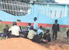  ??  ?? Locked out . . . Chancellor Junior Primary School pupils, whose parents and guardians had not paid school fees, were on Tuesday locked outside and barred from entering classrooms and school grounds