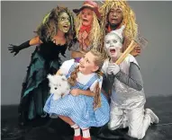  ??  ?? YELLOW BRICK ROAD: ‘Wizard of Oz’ cast members, back from left, Zoe Cristodoul­ou, as the Wicked Witch of the West, frightens Sophie France as the Scarecrow, and Hlelo Matika as the Cowardly Lion, along with, front, Serena Escola and Rachel Beukes as...