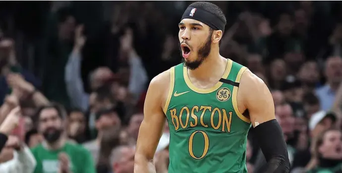  ?? MATT STONE / HERALD STAFF ?? ‘REALLY EXCITED’: Celtics forward Jayson Tatum screams in celebratio­n after hitting a basket against the Los Angeles Clippers on Thursday night.