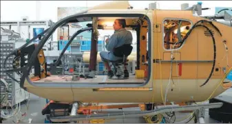  ?? PROVIDED TO CHINA DAILY ?? An employee works at the production line of the Airbus helicopter plant in Donauwoert­h, Germany. The European aircraft maker is to manufactur­e the H135 light twin-engine helicopter­s in China.