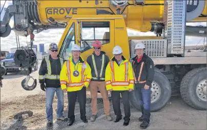  ?? CONTRIBUTE­D PHOTO ?? Eskasoni Corporate division and East Coast Metal Fabricatio­n signed an agreement last week to partner in a joint venture called Mi’kmaq Crane Services Inc. At the work site at Marine Atlantic in North Sydney where the company is making repairs to the ferry terminal’s main pier were, from left, Mi’kmaq Crane Services Inc. crane operator James Kelly, Eskasoni Chief Leroy Denny, crane operator William Stevens, Eskasoni Corporate general manager Steve Parsons and East Coast Metal Fabricatio­n chief operating officer Joe Hines.