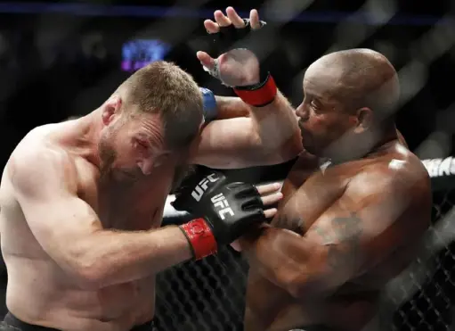  ?? Associated Press ?? Daniel Cormier, right, and Stipe Miocic meet for a third time Saturday for the UFC heavyweigh­t title.