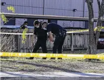  ??  ?? Sheriff ’s officers and Balcones Heights police investigat­e the scene. Officer Edgard Ortiz dragged Sgt. Joey Sepulveda to safety and rushed him to Methodist Hospital Texsan.