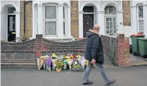  ??  ?? Floral tributes to Sami outside the family home near where he was stabbed