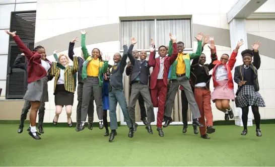  ?? Picture: Tracy Lee Stark ?? HIGH FLYERS. Top matric pupils pose for a picture at the top 30 matric achievers breakfast hosted by Basic Education Minister Angie Motshekga at Vodacom Dome in Midrand yesterday.