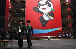  ?? REUTERS ?? SECURITY GUARDS keep watch at the National Exhibition and Convention Center, the venue for the upcoming China Internatio­nal Import Expo (CIIE), in Shanghai.