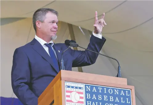  ??  ?? National Baseball Hall of Fame inductee Chipper Jones speaks Sunday during the induction ceremony at the Clark Sports Center in Cooperstow­n, N.Y. Jones, one of the greatest switch-hitters in baseball history, finished with a .303 career batting...