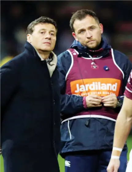  ??  ?? Under attack: Rory Teague, right, with Bordeaux president Laurent Marti, has endured insults from unhappy fans