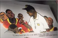  ?? John Bazemore / Associated Press ?? Artwork showing legendary Grambling football coach Eddie Robinson is displayed at the College Football Hall of Fame on Sept. 2 in Atlanta. The Hall has a new exhibit dedicated to historical­ly black colleges and universiti­es.