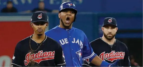  ?? CARLOS OSORIO/TORONTO STAR ?? Blue Jay Edwin Encarnacio­n was looking for his first RBI of the series until the seventh inning, when he knocked in a pair against Francisco Lindor, Jason Kipnis and the visitors from Cleveland.