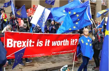  ??  ?? Anti-Brexit supporters demonstrat­e outside the conference centre at the annual Labour Party Conference in Liverpool. — Reuters photo