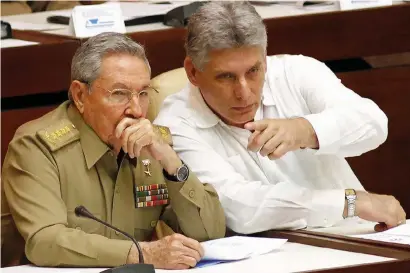  ?? AP file ?? Vice-President miguel Diaz-Canel Bermudez, right, is widely expected to take Raul Castro’s place as Cuba’s next president after tomorrow’s vote. —