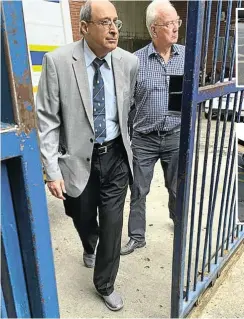  ?? Picture: Erin Bates ?? Professor Peter Beale, right, and the late Dr Abdulhay Munshi after appearing in the Johannesbu­rg magistrate’s court last month.