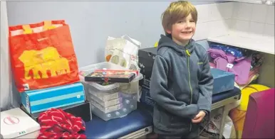  ??  ?? Harry Jordan, six, gave up his Christmas presents