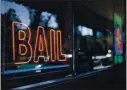  ?? DAI SUGANO — STAFF ARCHIVES ?? A neon sign is seen in the window of Bad Boys Bail Bonds in San Jose.