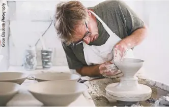  ??  ?? Neil working at the wheel at Tregear Pottery