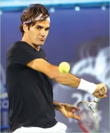  ??  ?? Roger Federer of Switzerlan­d returns to Michael Llodra of France during their ATP Dubai Open tennis match. Federer won the match 6- 0, 7- 6 ( 8/ 6). AGENCE FRANCE PRESSE