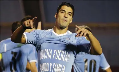  ??  ?? Luis Suárez celebrates after scoring for Uruguay in their World Cup qualifier against Chile in Montevideo on Thursday night. Photograph: Raúl Martínez/Reuters